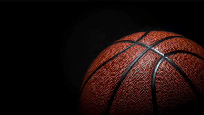 Close-up of a basketball against a black background