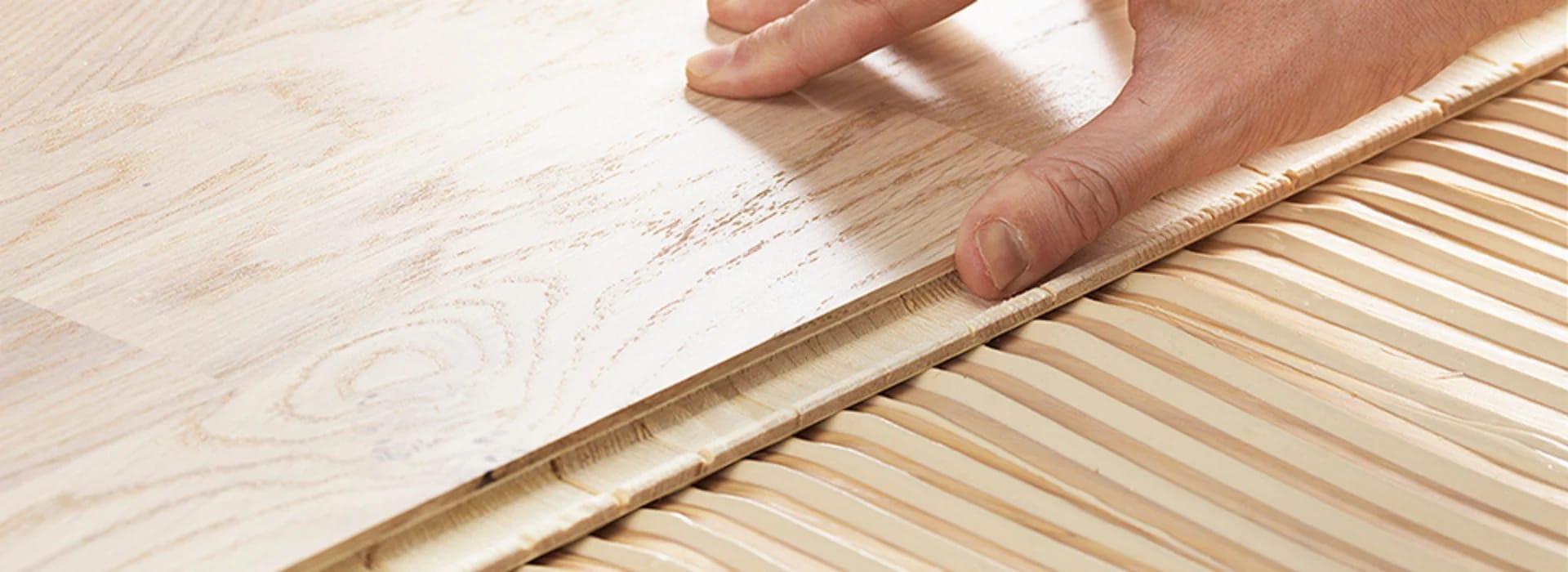 Adhesive being troweled on the floor